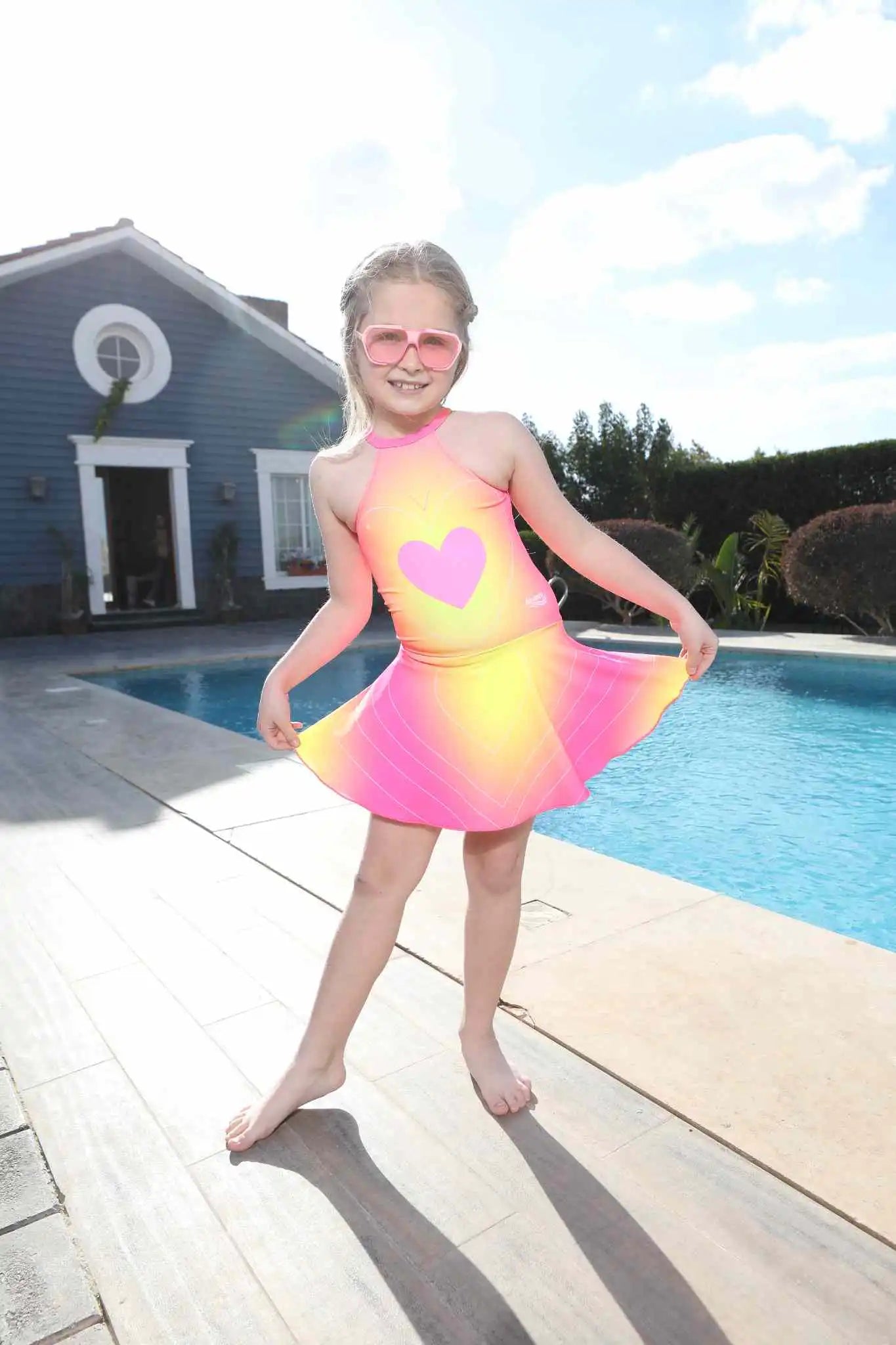 Kids' swimsuit and tiered full circle skirt for teens